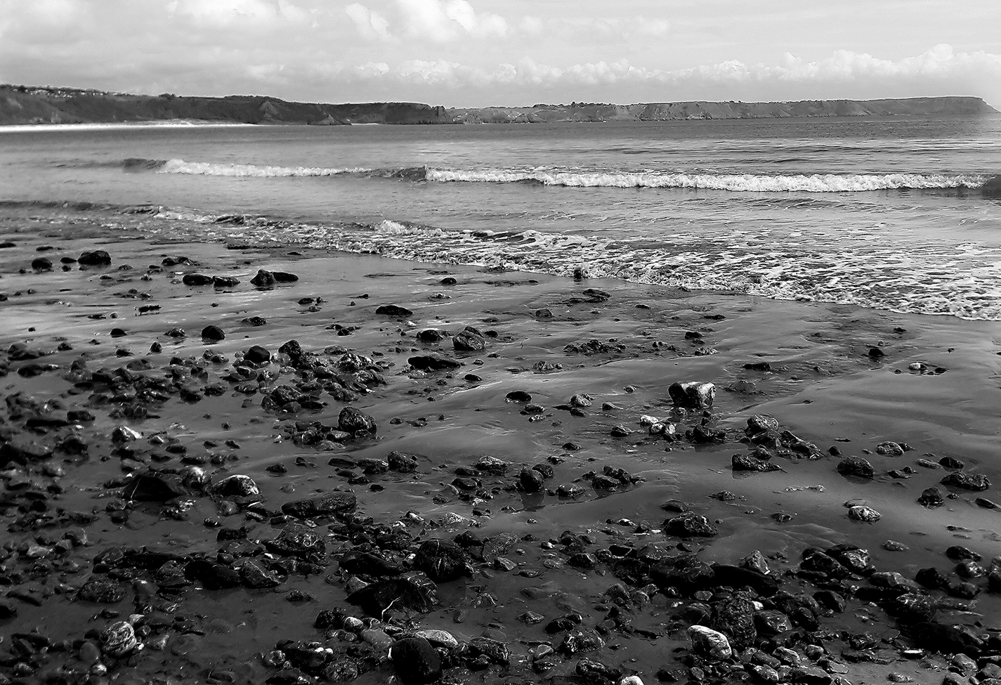 Black and white image of beach in South Wales